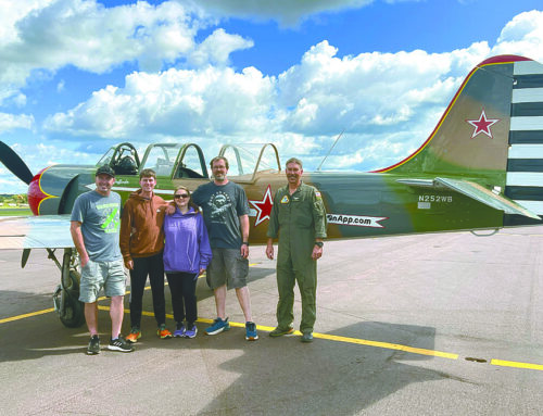 Youth flies high with aerobatic pilot