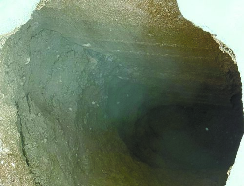 Mysterious sinkhole reappears at local store after recent filling