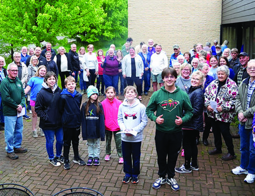 Peace Lutheran Church of Dresser celebrates with a mortgage-burning ceremony.